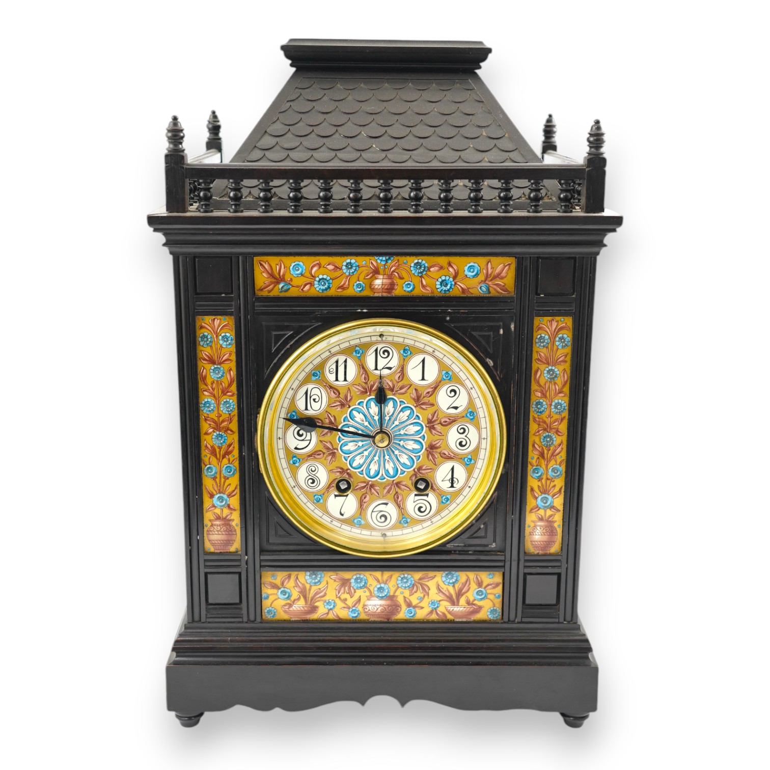 A Victorian Aesthetic Movement ebonised architectural mantel clock, probably designed by Lewis Foreman Day